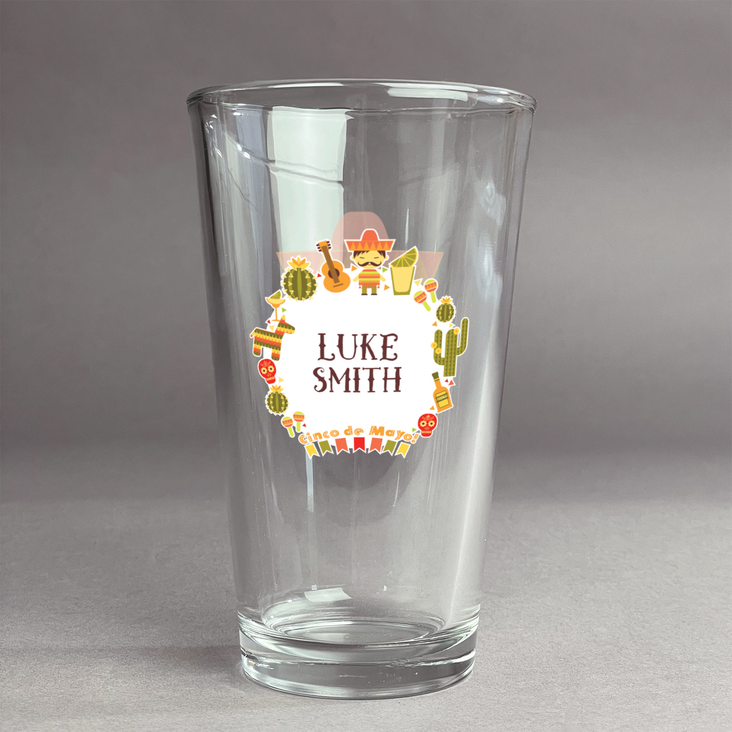 https://www.youcustomizeit.com/common/MAKE/1564444/Fiesta-Cinco-de-Mayo-Pint-Glass-Two-Content-Front-Main.jpg?lm=1654889803